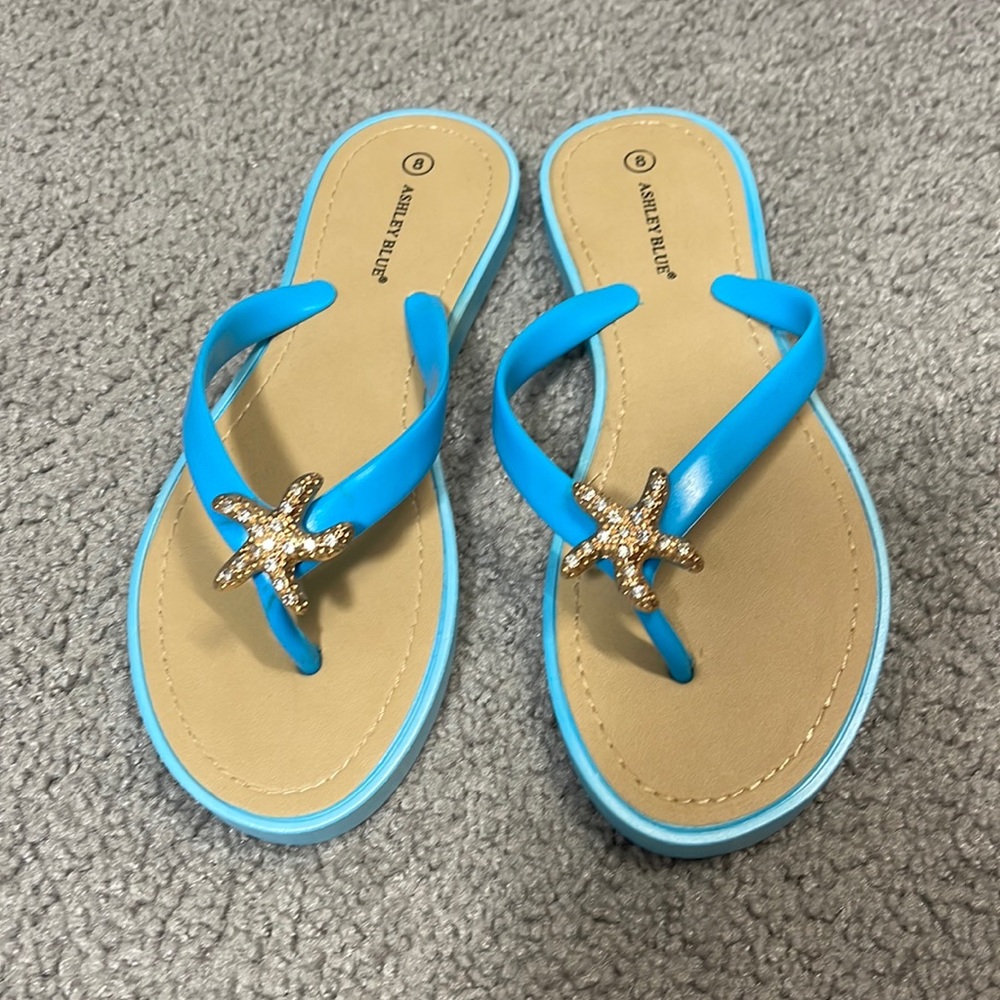 Blue sandals with starfish emblem